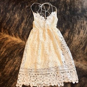 White lace dress. Criss cross open back.